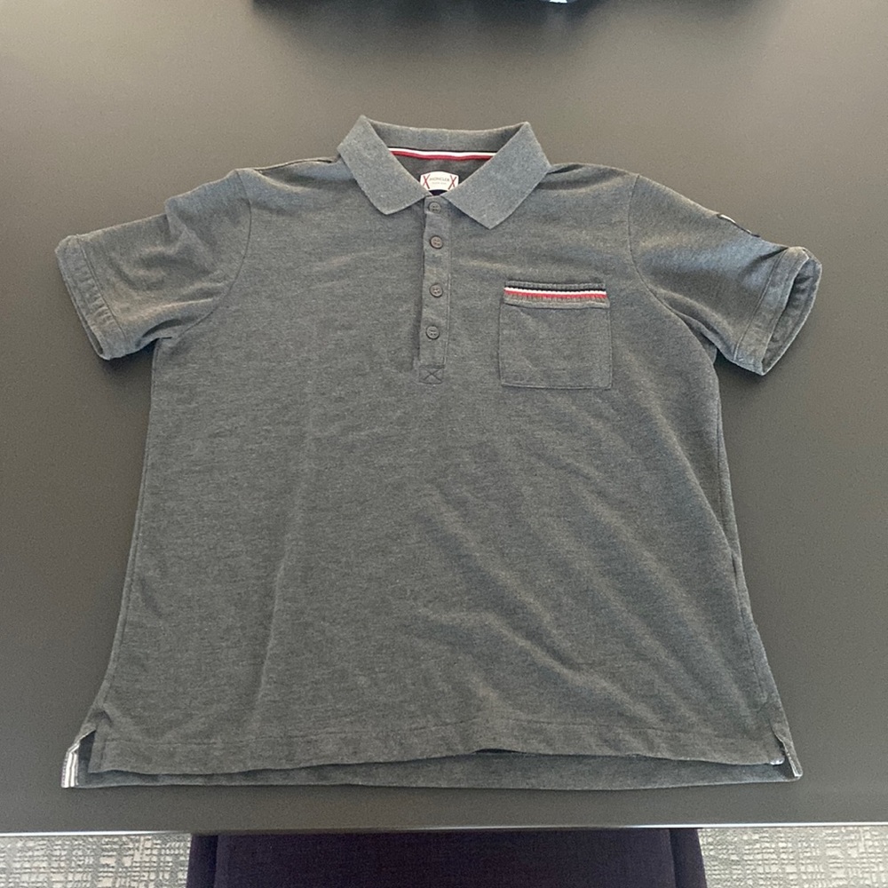 Classic Gray Moncler Polo in a size medium, perfect for a casual night out.